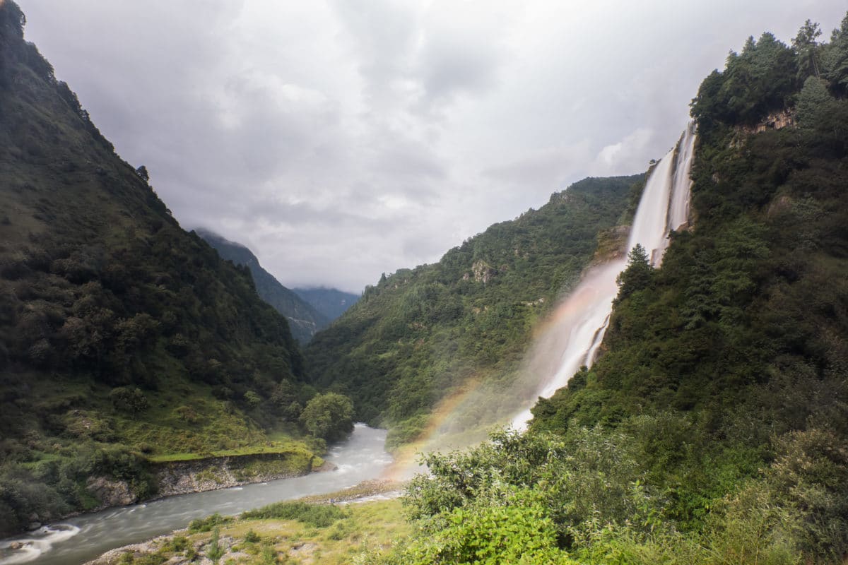 A beautiful waterfall we encountered outside the little town of Jung on our way to Tawang.. don't miss the rainbow!